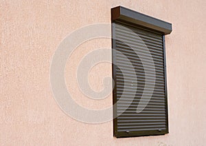Window with rolling shutter and copy space. Window with rolling shutter for house protection.