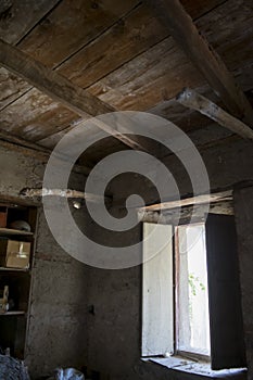 Window in a room of an old hut