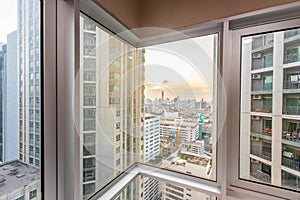 The window of the room overlooks the tall building