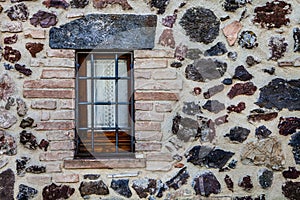 Window rustic house with railings. Protection from thieves