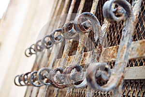 Window with rusty decorated bars