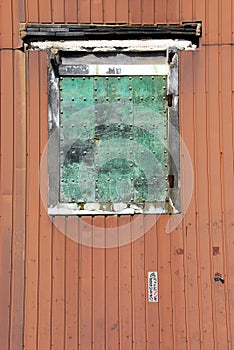 Window with rusty shutter