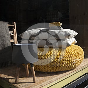 Window shop of old shop with antique vintage pillow and lamp
