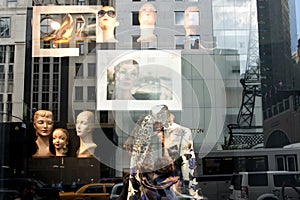 Window shopping New York - reflections from high rise buildings and advertising with Tour Eiffel in window pane. Inside, outside.