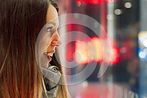 Window shopping, woman looking at the store. Smiling woman pointing at the shop window before entering stor.