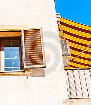 Window shutters on an old european style building, architectural