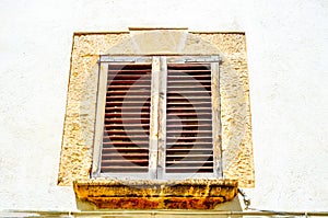 Window shutters on an old european style building, architectural