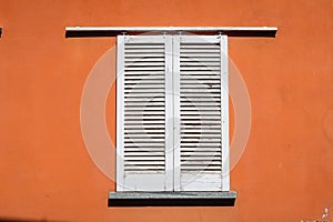 Window shutters white brown wall characteristic detail close up borgo