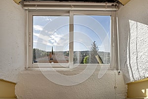Window with sliding aluminum and glass sashes with mountain views