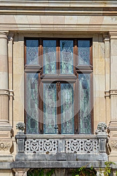 Window stained glass window with a balcony in Peles Castle in Romania