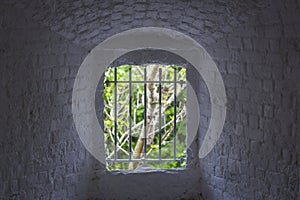 Window in a stone tower in Garinish Island, County Cork, Ireland photo