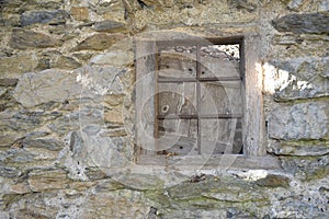 Window in stone wall on the farmhouse