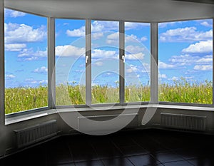 Window with summe view. Landscape field and cloudy sky