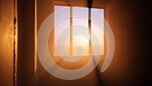 Window with a sun shining through it