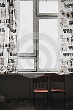 Window with two chairs