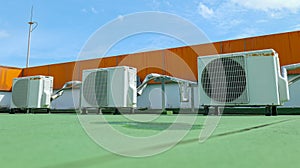 Window-type air conditioner outdoor condenser unit installed on a building rooftop