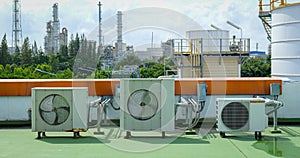 Window-type air conditioner outdoor condenser unit installed on a building rooftop