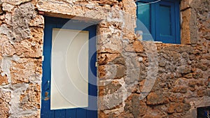 Window of a typical Siclian house with blue color in Marzamemi