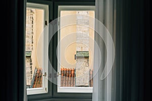 Window view from old European building in Prague