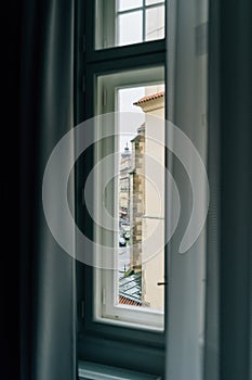 Window view from old European building in Prague