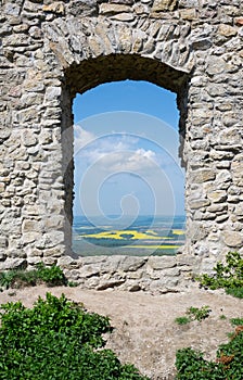 Window in wall of anctique building made of stone