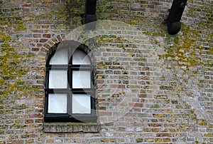 Window and wall of an old Dutch windmill