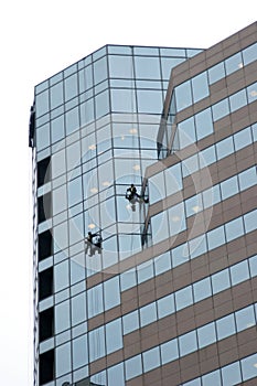 Window washers on skyscraper photo