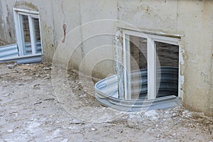 A window well will be installed in basement of new house under construction