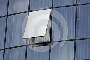 A window with a white curtain is open