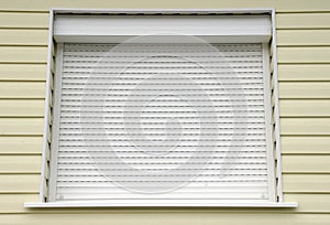 Window with white external blinds house