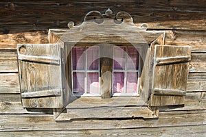 Window of a wodden hut in Austria photo
