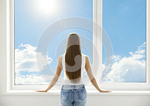 Window and Woman, Back View of Young Girl Standing in White Home
