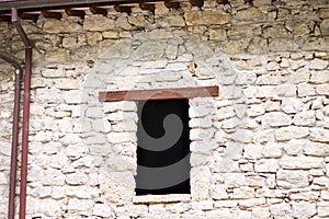 A window with a wooden lintel of an abandoned ruined building Italy, Europe