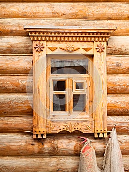 Window in wooden log house in Russian village in the middle Russ