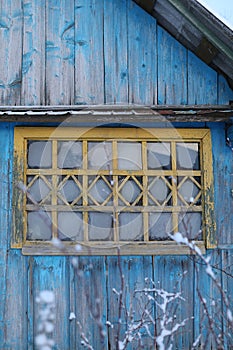 Window of the wooden old house. Home exterior. textured wooden background