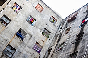 Windows of an abandoned building used as slum.