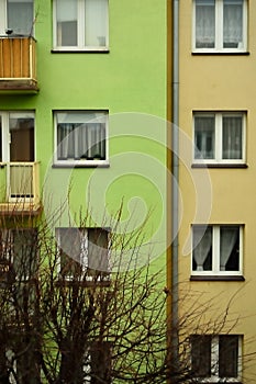 Windows and balconies in a multi-family house. Evening