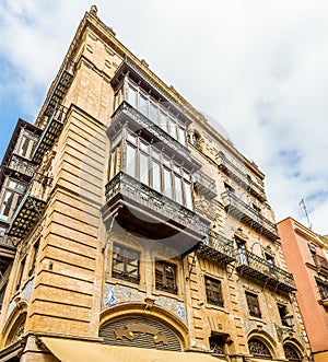 Windows and balconies in a street in Seville, Spain