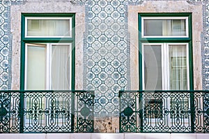 Windows with balconies and tiles typical in Portugal