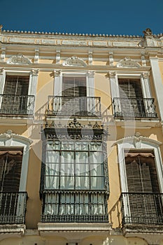Windows with balcony on old building of Merida