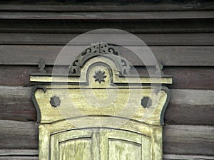 The windows with beautiful architraves in old wooden house. Ulan-Ude.