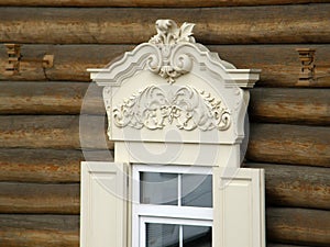 The windows with beautiful architraves in old wooden house. Ulan-Ude.