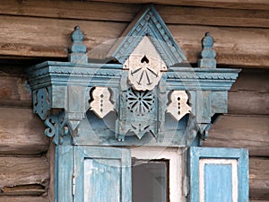 The windows with beautiful architraves in old wooden house. Ulan-Ude.