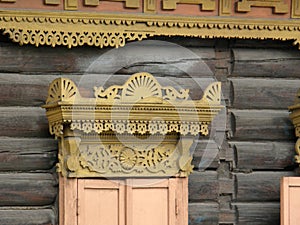 The windows with beautiful architraves in old wooden house. Ulan-Ude.