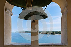 Windows with a bell in the Euphrasian Basilica in Porec, Croatia