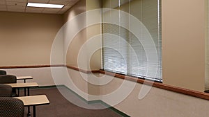 Windows with blinds in empty classroom