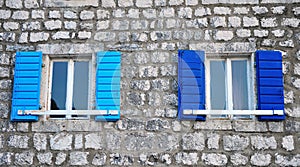 Windows with the blue blinds