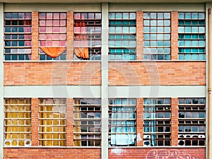 Windows with broken glass and color courtain
