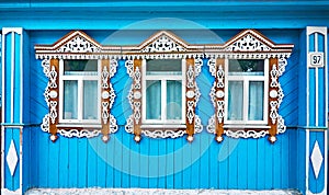 Windows with carved platbands in russian house