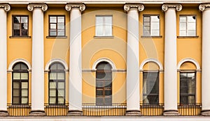 Windows and columns in a row on facade of apartment building